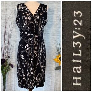 Hail3y:23 black with white floral sleeveless wrapped A-line dress.